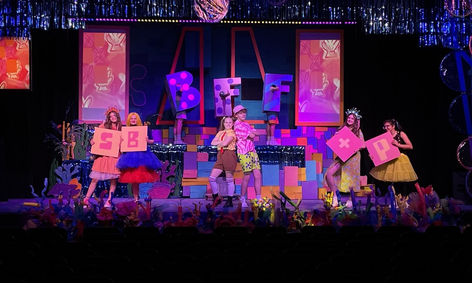 students onstage